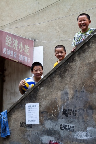 3 smiling young Chinese boys