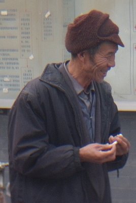 Smiling Chinese man in hutong