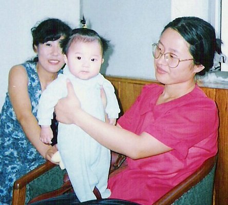 Orphanage workers with baby