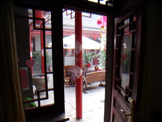 Looking out a hutong room door to the courtyard