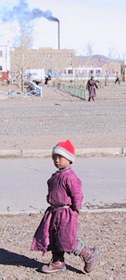 Mongolian boy with tattered deel