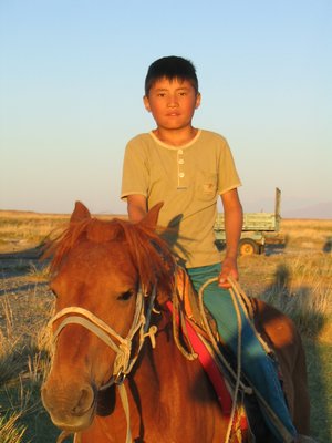 Mongolian boy on horse